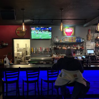 Inside My Bar — the bar glowing blue with the game on